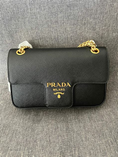 prada milano bag very stiff leather with all leather handles